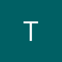T.